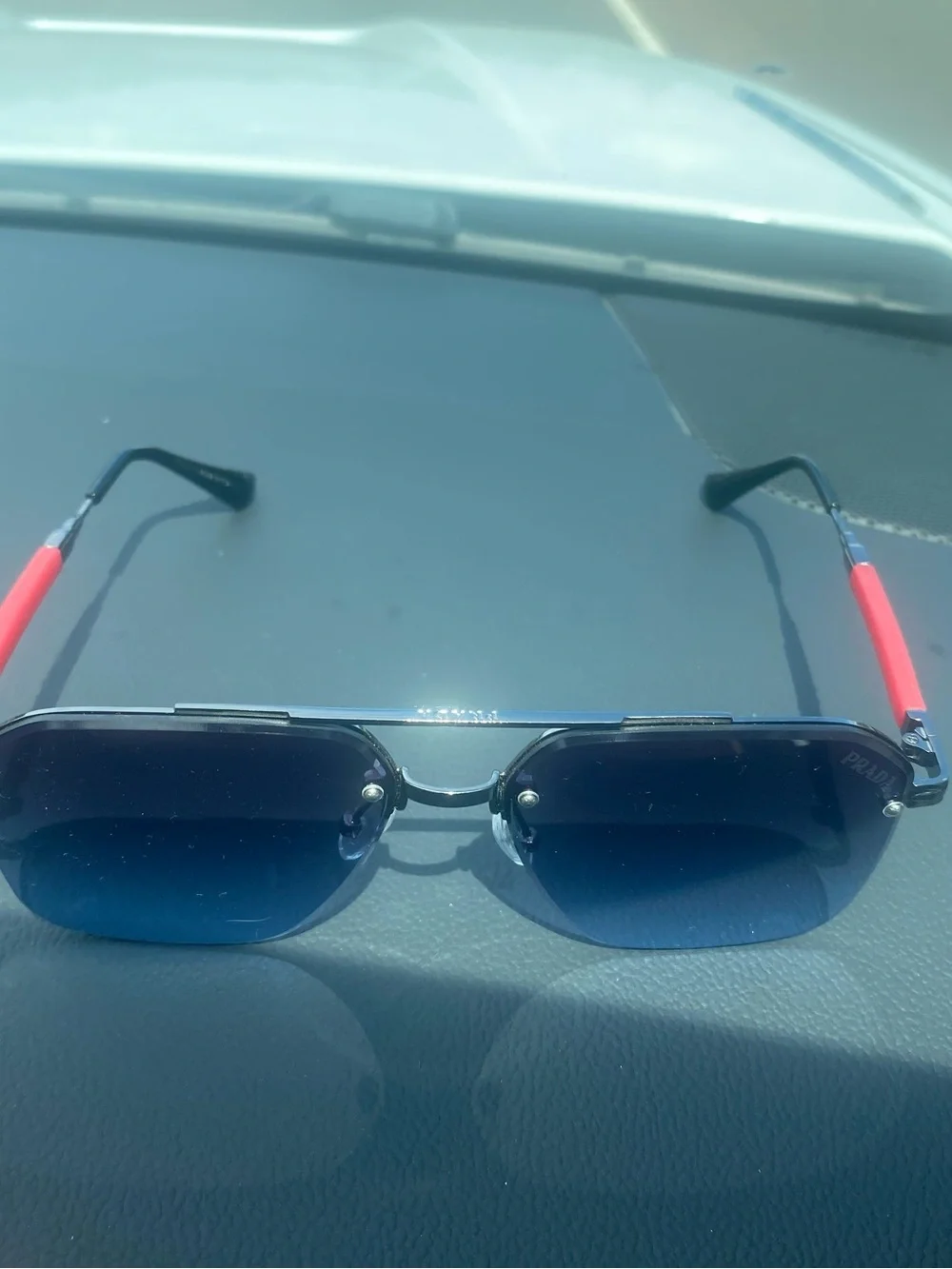 Prada Blue Gradient Rimless Sunglasses with Red Temples